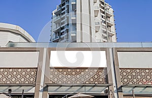 white clipping mock up for the advertisement with some ornamentation below the huge tall building
