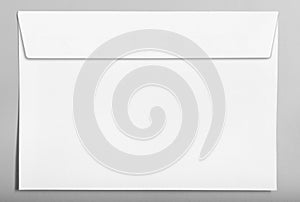 White closed blank envelope isolated on grey background