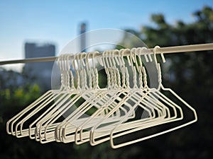 White Cloth hangers were hanging on clothesline