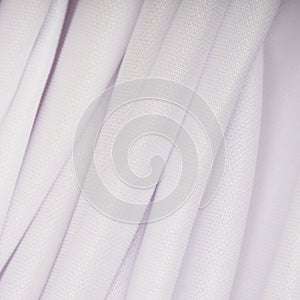 White cloth with pink shade in the folds