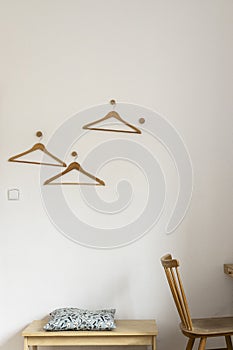 White Clothes hanger on a wall background