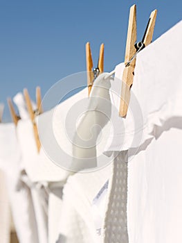 White clothes hung out to dry in the bright warm sun