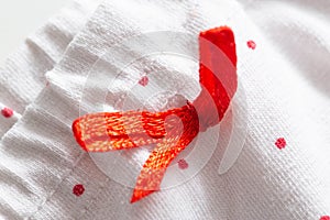 white clothes with red patterns and elastic band, macro