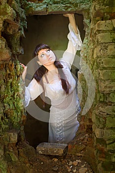 White clothes on a young girl on brick wall background