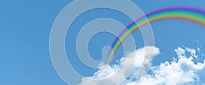 White cloud and blue sky and  rainbow background with copy space