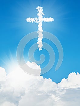 White cloud Christian cross and blue sky photo
