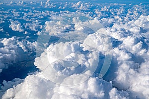 white cloud clusters seen from above from an airplane