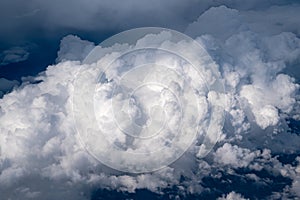 white cloud clusters seen from above from an airplane