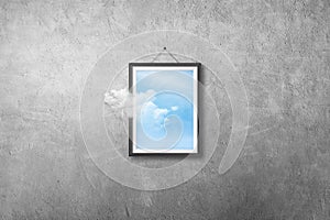 White cloud flying out from picture or photo frame that hanging on concrete wall grunge texture background.