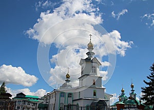 White clouds above the church under the blue sky in the city of Kanash, Russia