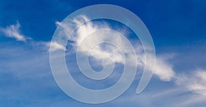 White clouds against blue sky as background