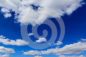 White clouds against blue sky as background