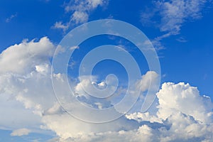 White clouds against the blue sky background.