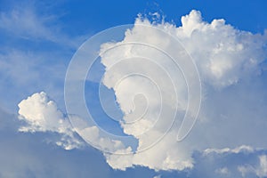 White clouds against the blue sky background.