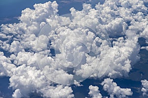 White clouds from airplane window photo
