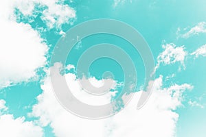 White clouds on the aquamarine aqua menthe color sky background