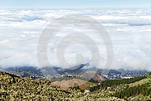 White clouds. Beautiful amegine view from peak of mountains Gran Canaria island.