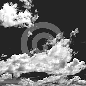 White clouds on a black background, monochrome image of clouds