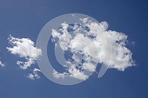 White clouds on a blue sky. Background