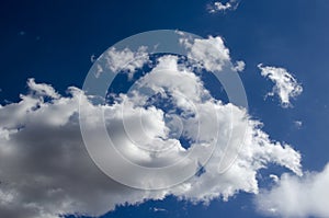 White clouds on a blue sky. Background