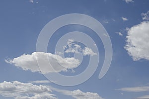 White clouds on a blue sky. Background