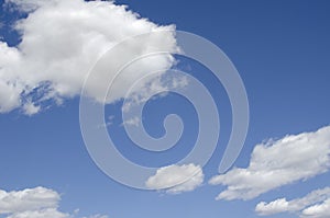 White clouds on a blue sky. Background