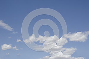 White clouds on a blue sky. Background