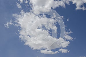 White clouds on a blue sky. Background