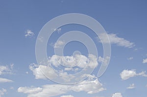 White clouds on a blue sky. Background