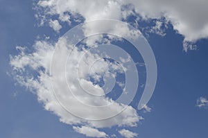 White clouds on a blue sky. Background