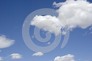 White clouds on a blue sky. Background