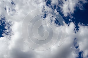 White clouds on a blue sky. Background