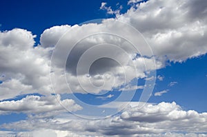 White clouds on a blue sky. Background