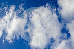 White clouds on a blue sky. Background