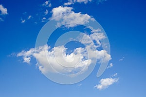 White clouds on a blue sky. Background