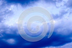 White clouds on a blue sky. Background