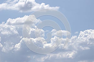 White clouds on a blue sky. Background