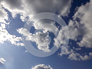 White clouds on a blue sky. Background