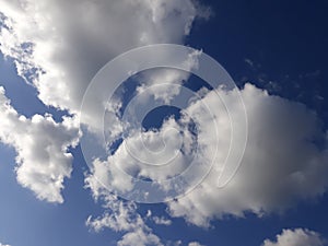 White clouds on a blue sky. Background