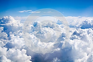 White clouds on blue sky background close up, cumulus clouds high in azure skies, beautiful aerial cloudscape view from above
