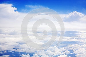 White clouds on blue sky background view from above, airplane flight landscape, beautiful aerial cloudscape, skies backdrop
