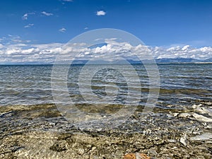 White clouds and blue sky over the lake