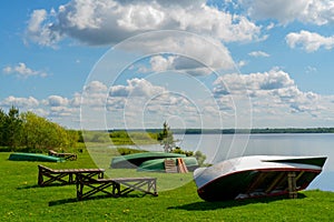 White clouds in the blue sky over the river.
