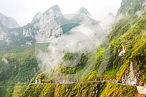 White clouds cover the mountains rocky Global Geopark in Ha Giang, Vietnam