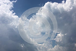 White clouds disappear in the hot sun on blue sky. Motion white clouds blue sky background