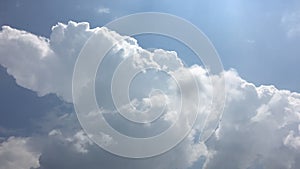 White clouds disappear in the hot sun on blue sky. Time-lapse motion cloud blue sky background. Blue sky with white