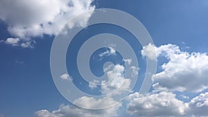 White clouds disappear in the hot sun on blue sky. Time-lapse motion clouds blue sky background. Blue sky. Clouds