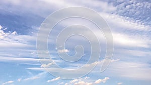 White clouds disappear in the hot sun on blue sky. Time-lapse motion clouds blue sky background. Blue sky. Clouds.