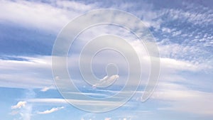 White clouds disappear in the hot sun on blue sky. Time-lapse motion clouds blue sky background. Blue sky. Clouds.