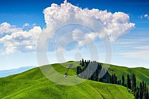 The white clouds upon the mountains in summer grassland